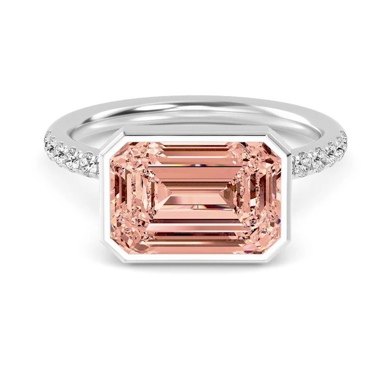 East west emerald-cut engagement ring in yellow gold
